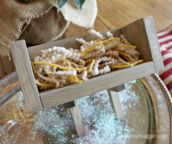 Create a DIY manger and then fill it with service for Baby Jesus! A simple, inexpensive family project to celebrate the true meaning of Christmas | Gypsy Magpie