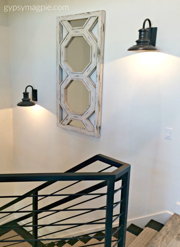 The industrial style railing in this home was really fun and the wall sconces had me drooling! Come check out more! | Gypsy Magpie