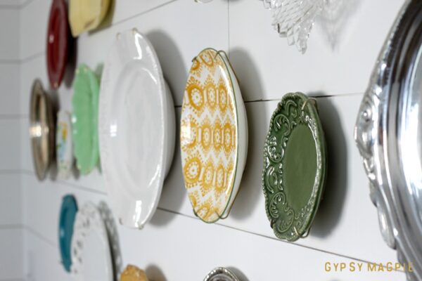 Create a pretty family history plate wall using all those special dishes gather dust in a box in the basement. The design possibilities are endless! | Gypsy Magpie