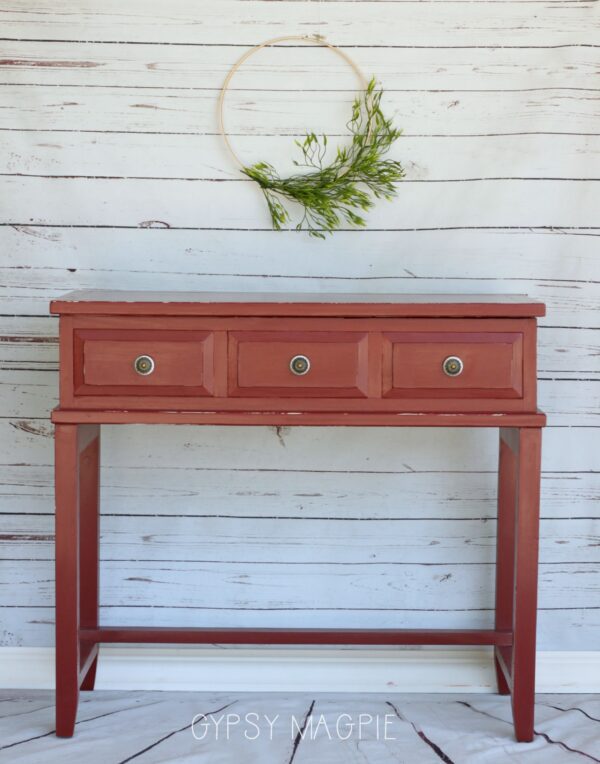A little red paint, honeycomb paper, and new knobs gave this water stained console new life! | Gypsy Magpie