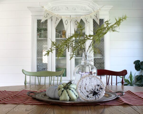 Need some Halloween decor that fits in with your farmhouse style? This spider web doily wreath is darling and so easy to make! | Gypsy Magpie
