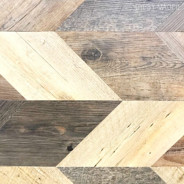 Wood set in a pattern is so trendy right now. This wood wall was definitely a statement! | Gypsy Magpie