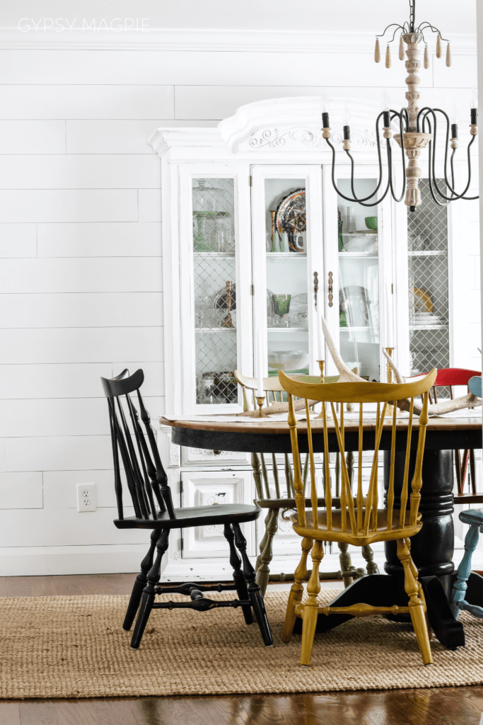 Darling dining room with shiplap walls and mismatched chairs | Gypsy Magpie