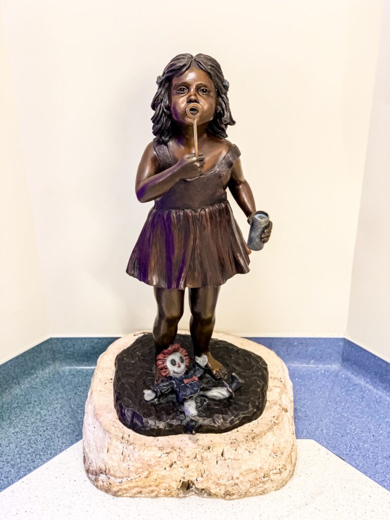 Beautiful sculpture of a little girl blowing bubbles at Primary Children's Hospital | gypsy magpie
