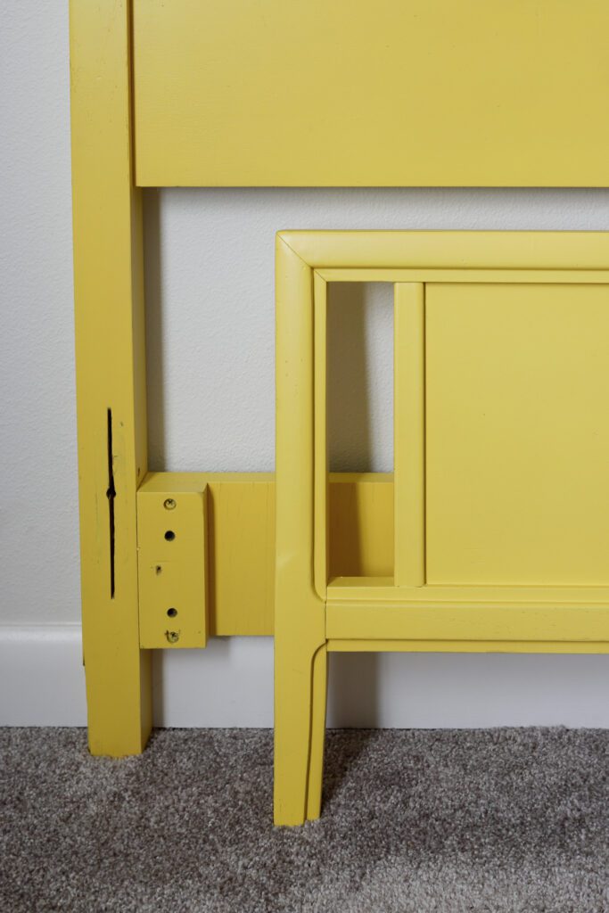 Yellow paint was the perfect touch for this vintage twin bed