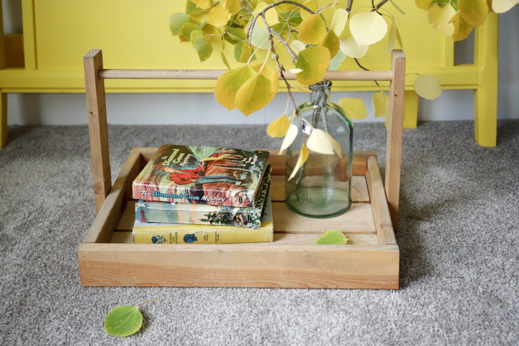 Vintage books on a creative little DIY wooden tray